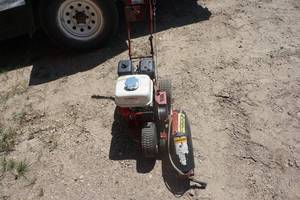 lot 19 image: Brown Redefiner Model R4604A Gas Powered Edger