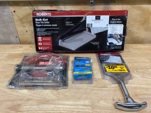 Lot of various flooring tools.  Carpet trimmer, vinyl cutter, carpet blades and T-handle carpet tucker