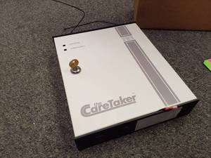 lot 179 image: ITI The CareTaker Household Fire and Burglary Warning System Control Unit with Supplies