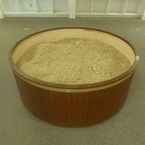 lot 190 image: 61 x 24 Round Rolling Planter Display with Rubber Mulch