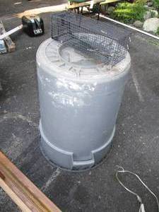 lot 221 image: Live Trap & Rubbermaid Garbage Can...