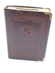 lot 321 image: Antique Metal Investors Syndicate Piggy Bank with Undisclosed Amount of Foriegn and National Coin