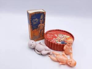lot 324 image: Rare Dolls Two Celluloid babies, Bisque Baby, The Little Squirt, and Dorrys Bath Set