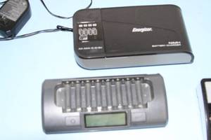 lot 95 image: Lot of Miscellaneous 9V AA Battery Chargers and Accessories