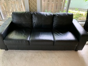 lot 6 image: Black Faux Leather Sofa
