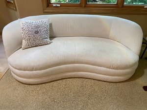 lot 19 image: Curved Contemporary Ivory Upholstered Sofa