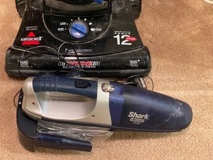 lot 68 image: Bissel Upright Vacuum Cleaner and Shark Handheld