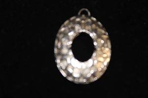 lot 67 image: Coach Silvertone Oval O Pendant