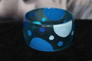 lot 53 image: Mod Wide Translucent Blue Lucite Bangle