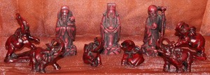 lot 106 image: Lot of Small Red Resin Buddha & Elephants