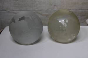 lot 163 image: Two Frosted Glass World Globe Paperweights