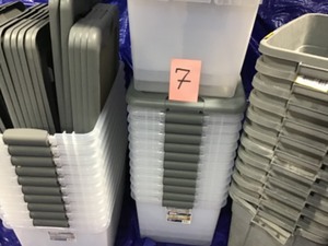 Pallet with mix storage bins different sizes and colors some missing covers includes a garbage can