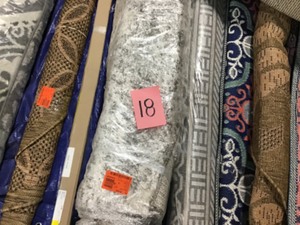 Lot of mix area rugs different sizes and styles most not used
