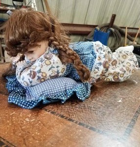 lot 15 image: Two Laying Dolls, One  with Orange Flower Clothing and One with Blue Flower Clothing