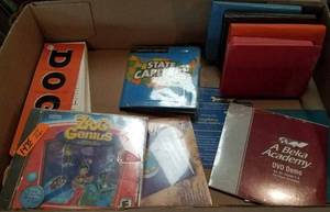lot 16 image: About 15 DVDsCDs Home School Curriculum and American Girl Book Set