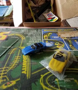 lot 102 image: Tyco Zero Gravity Electric Race Set with Nite Glow, has 2 Corvette Cars