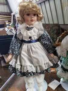 lot 123 image: Three Porcelain Dolls Up to 16 inches in Height
