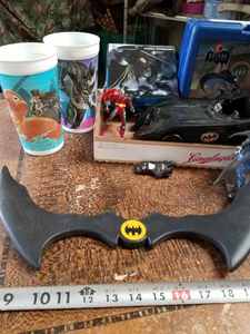 lot 126 image: Batman Puzzles, Lunchbox, Action Figures, Cups, 1989 Batmobile and More