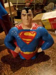 lot 211 image: Two Superman Items, 30 inch Big Fig Action Figure and a Ceramic Superman Bank