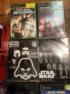 lot 233 image: Three Star Wars X Box Games, Other Star Wars Games and Two Star Wars Titanium Space Ships