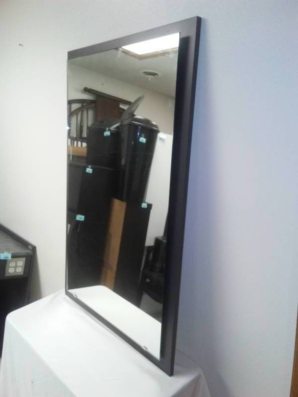 lot 81 image: Floating 42.75 mirror on black frame- nice, 43.5 x 27.75