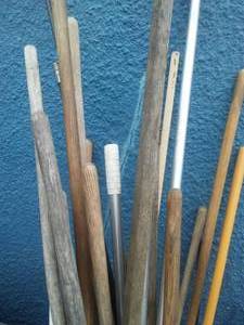lot 103 image: Garden tools, brooms, snow rake, Chimney brush & more.