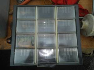lot 124 image: Storage bin - 12 drawer, hardware, pulleys,  & more.