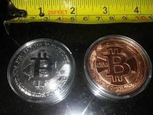 lot 152 image: Authentic Bitcoins - both 1 ounce copper.