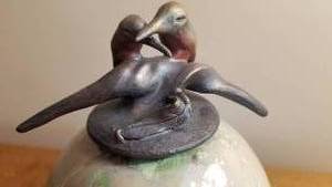 lot 84 image: Art Pottery Lovebird Lidded Jar