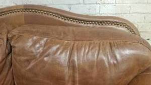 lot 6 image: Beautiful Brown Distressed Leather Love Seat