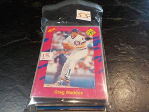 lot 55 image: 50 Greg Maddux Cards...