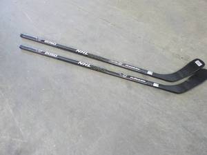 lot 275 image: 2 - 2050 Hockey Sticks...