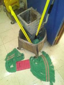 lot 509 image: Rubbermaid Wet Floor Sign and Roller Scrub Bucket Set up with new mop head.