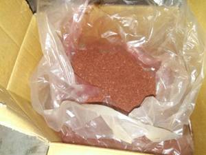 lot 579 image: Sweeping Compound 50 pound box nearly full.