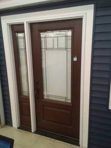 lot 127 image: Exterior door with sidelight.