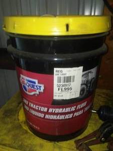 lot 651 image: Unopened Car Quest Hydraulic Fluid, Grease Gun and more.