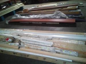 lot 810 image: 3 long pallets of siding, molding, etc. HUGE Lot LK at all pics.
