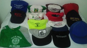 lot 484 image: 13 caps hats and a t shirt.