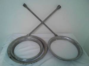 lot 323 image: Chrome trim rings & tire iron cross.