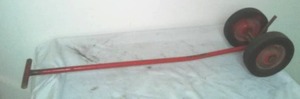 lot 468 image: Handy tow mechanism. 8 in.  tires 36 inch long handle.