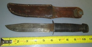 Vintage knife with leather sheath.