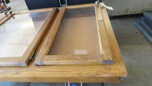 Wooden Cabinet with Pegboard Behind glass doors