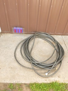 50 garden hose. New condition. As shown.