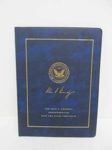lot 136 image: John F. Kennedy Commemorative Coin & Stamp Portfolio