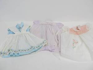 lot 139 image: 3 Vintage Signed NANNETTE Inspired by Shirley Temple Doll Outfits