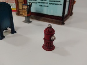lot 228 image: Vintage A.H.M. Fire House Building Kit and 1st Edition Chelsea Street Books Statue