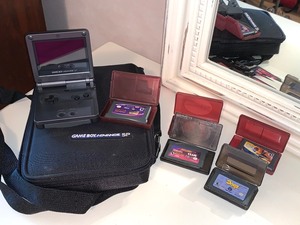 lot 127 image: Game Boy Advance wCase and Games