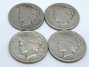 lot 154 image: Four 1922 S Peace Dollars