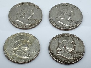 lot 159 image: Four Ben Franklin Half Dollar Coins