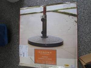 lot 407 image: Round Patio Umbrellas Stand In Box...